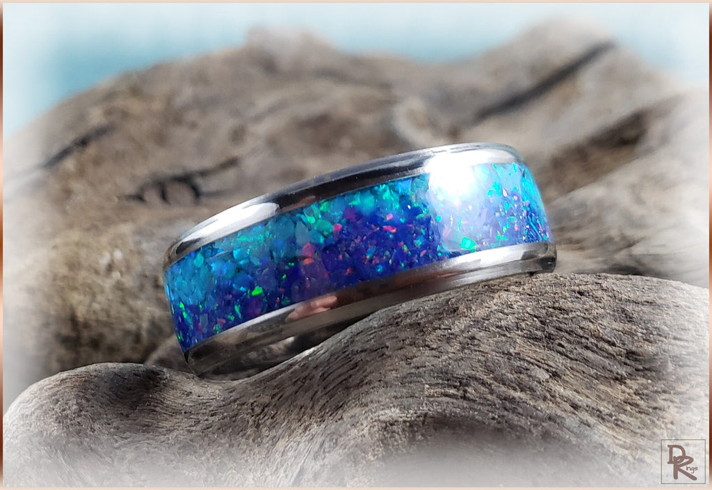 DR Rings titanium ring with opal featuring vibrant blue and green opal inlay on a polished band