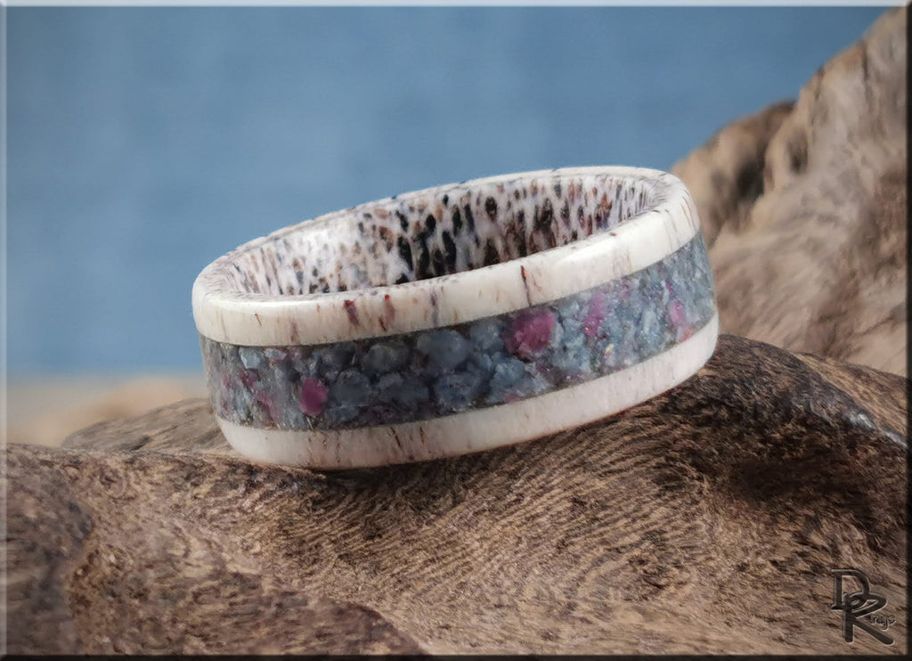 Antler ring with kyanite and ruby inlaid band on textured rustic background by DR Rings