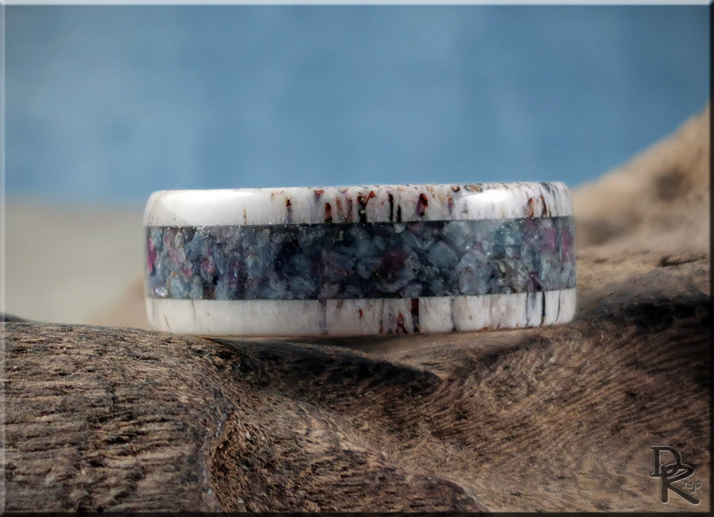 DR Rings antler ring with kyanite and ruby inlay on rustic wood background