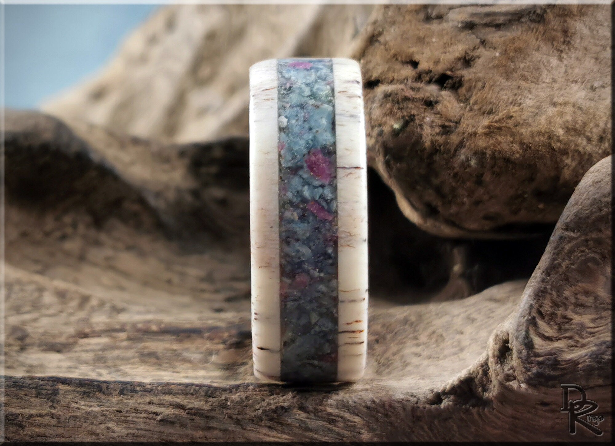 DR Rings antler ring with kyanite and ruby inlay on wooden background