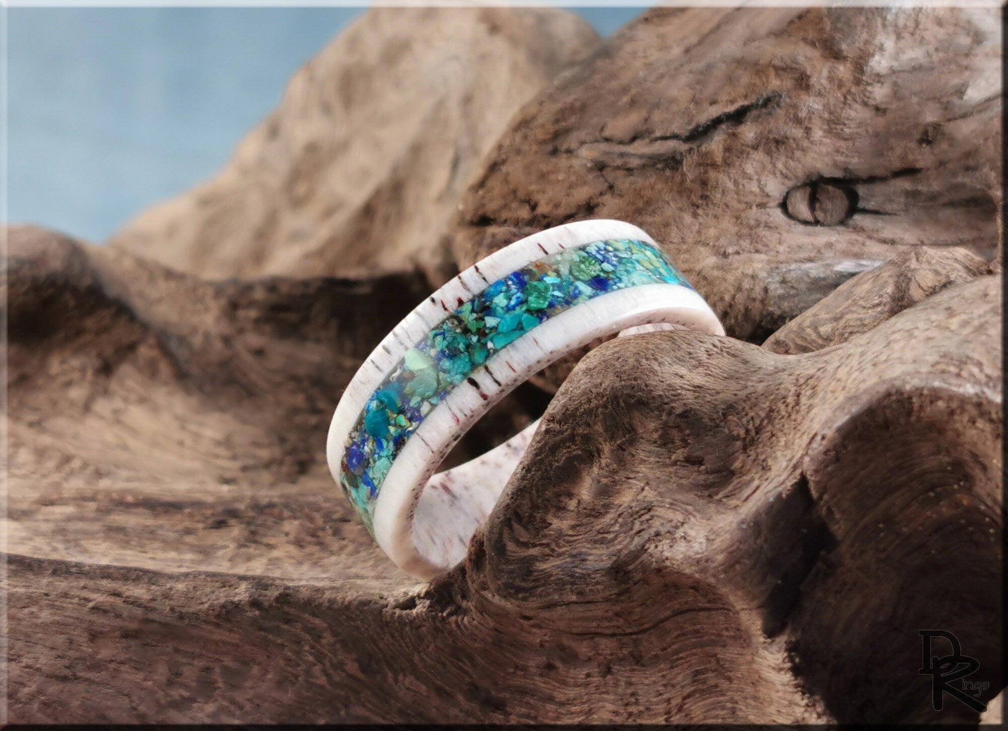 Antler Ring with stone inlay featuring vibrant blue and green stones set in a natural antler band