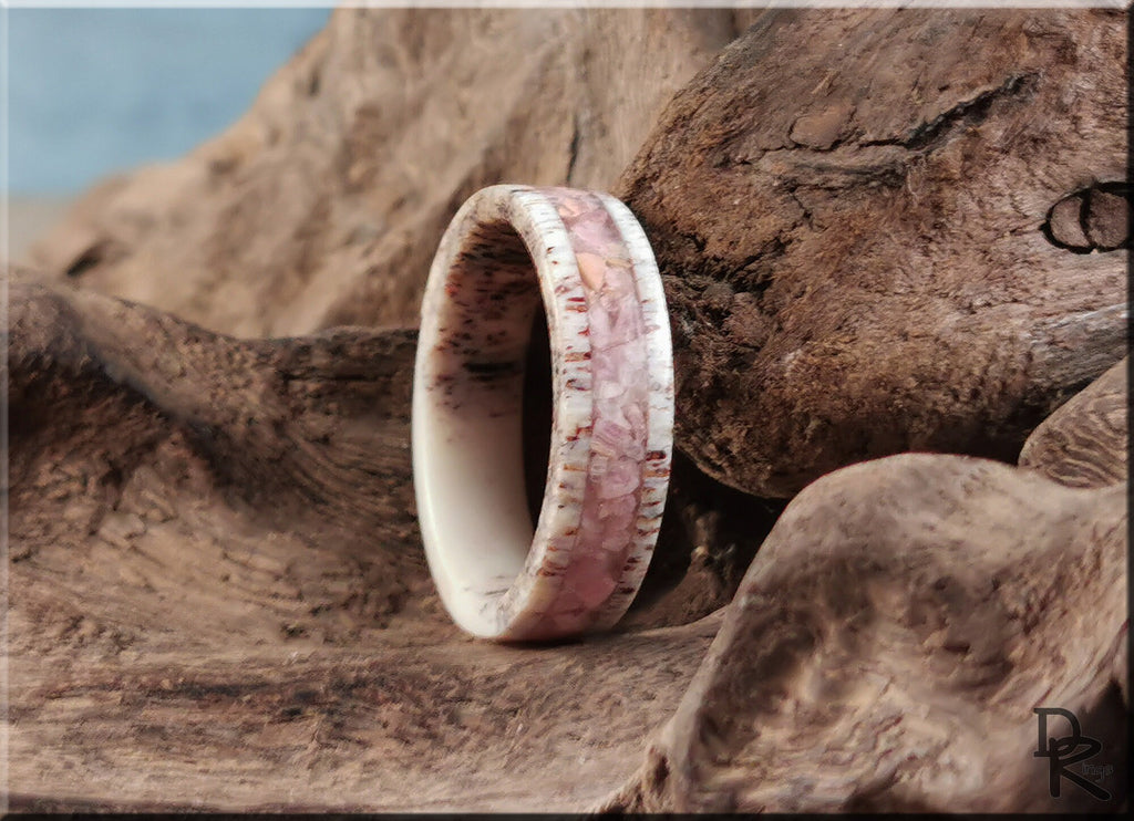 DR Rings Antler Ring with stone inlay in soft pink and white tones on rustic wood background