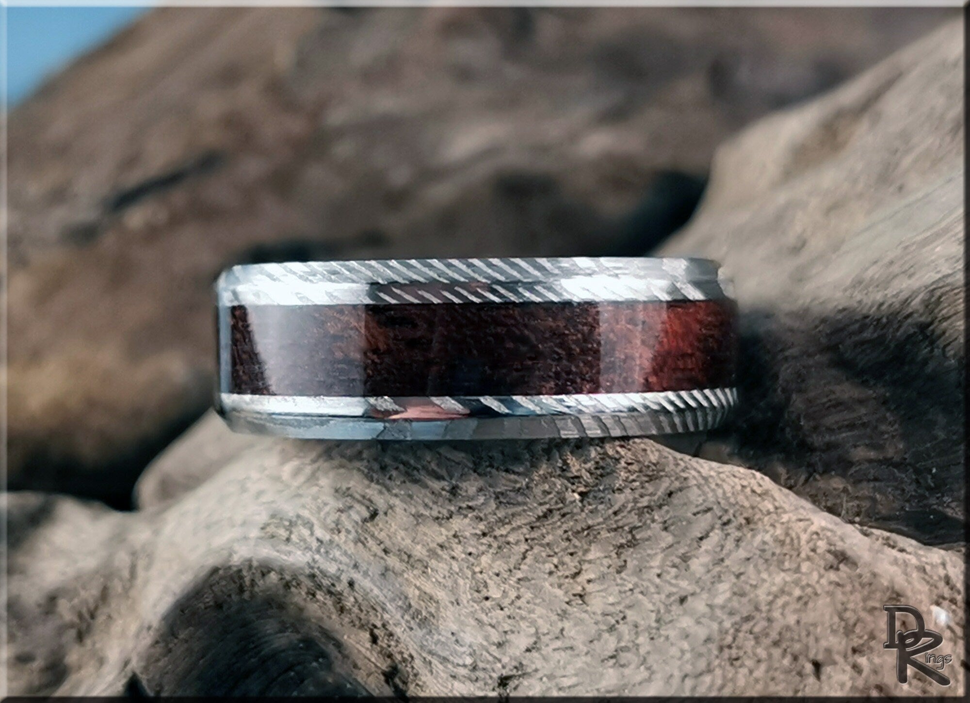 Damascus steel ring with wood inlay from DR Rings showing detailed texture and natural wood grain