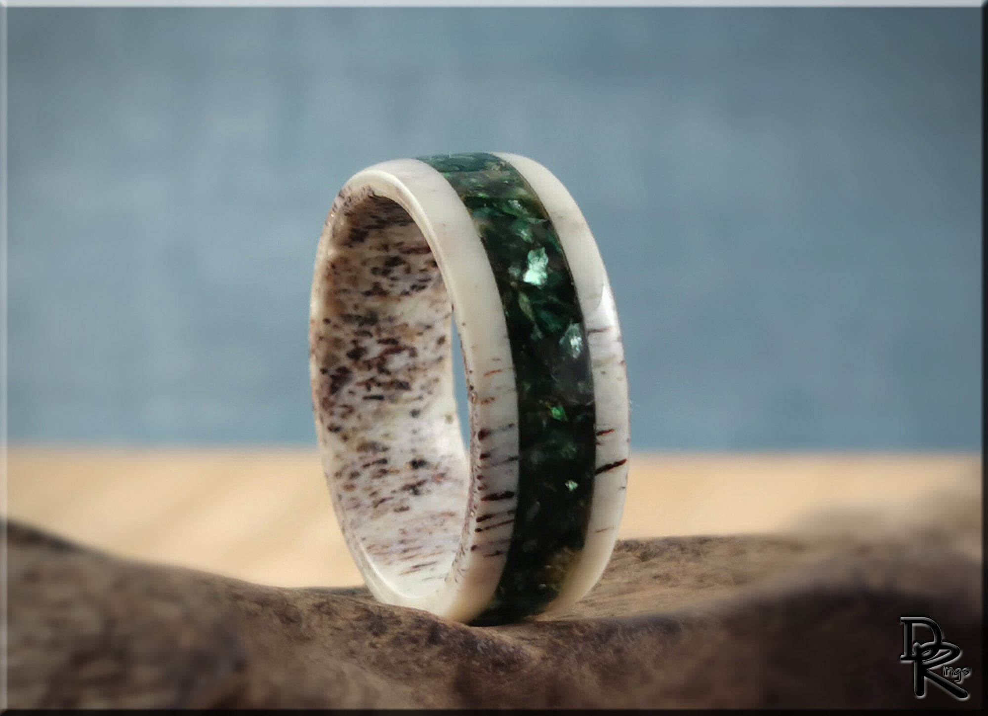 DR Rings antler ring with mica green inlay and natural texture on wooden surface