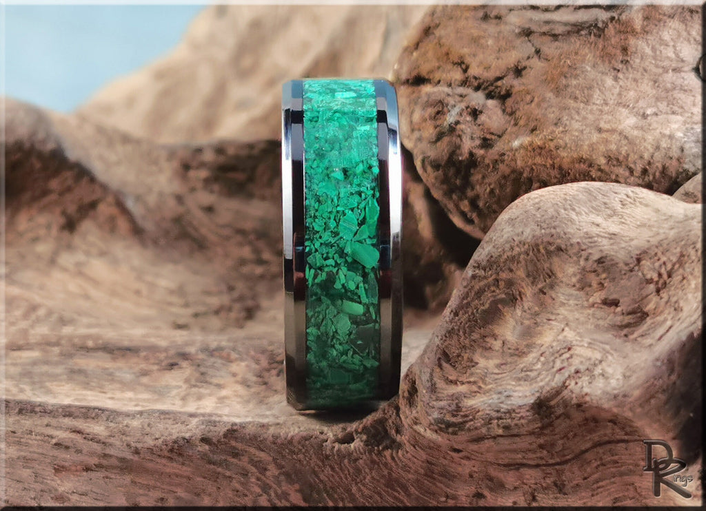 DR Rings black ceramic ring with green inlay displayed on textured wooden surface