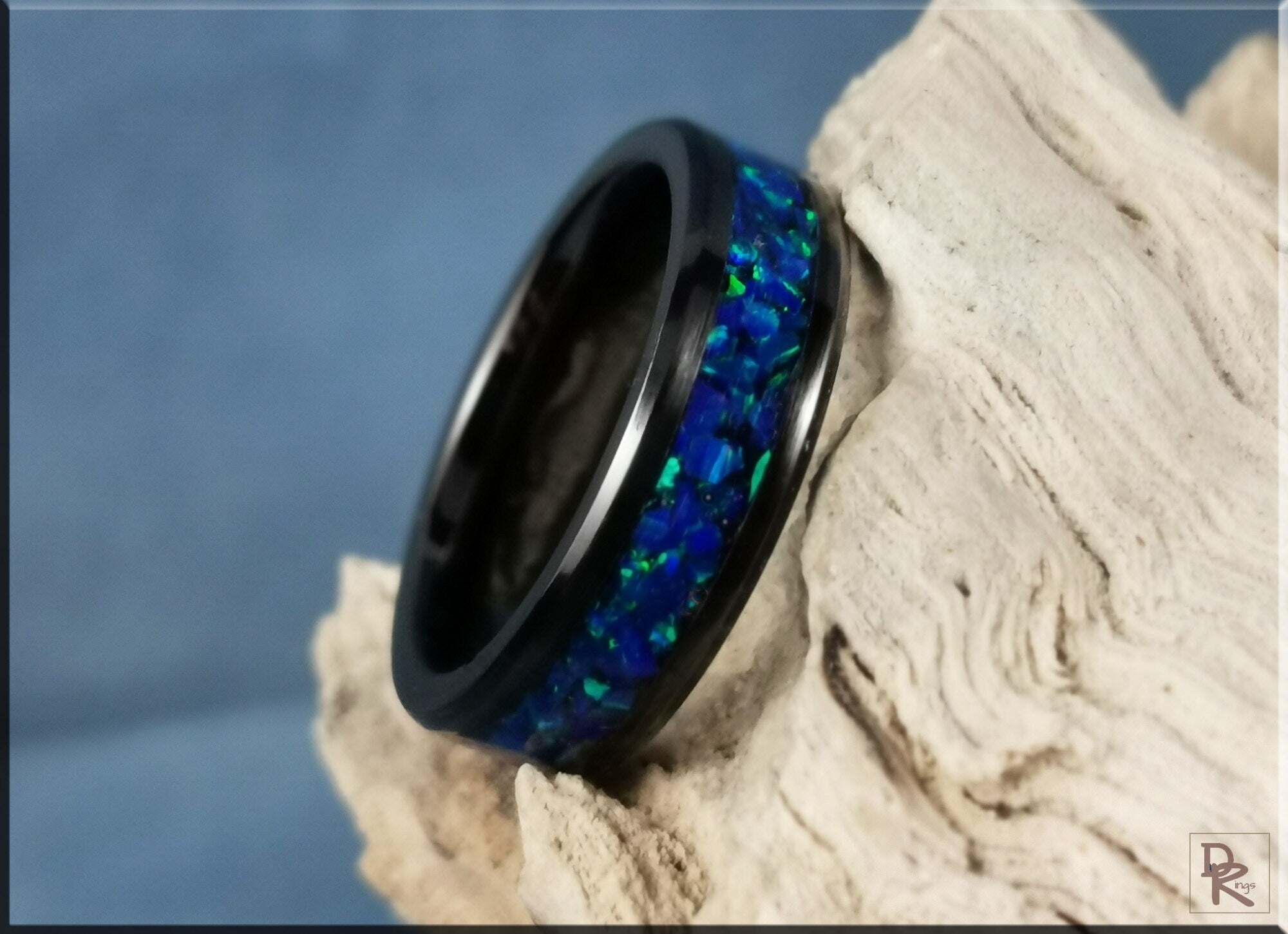 Black ceramic ring with inlay featuring blue and green opal design from DR Rings