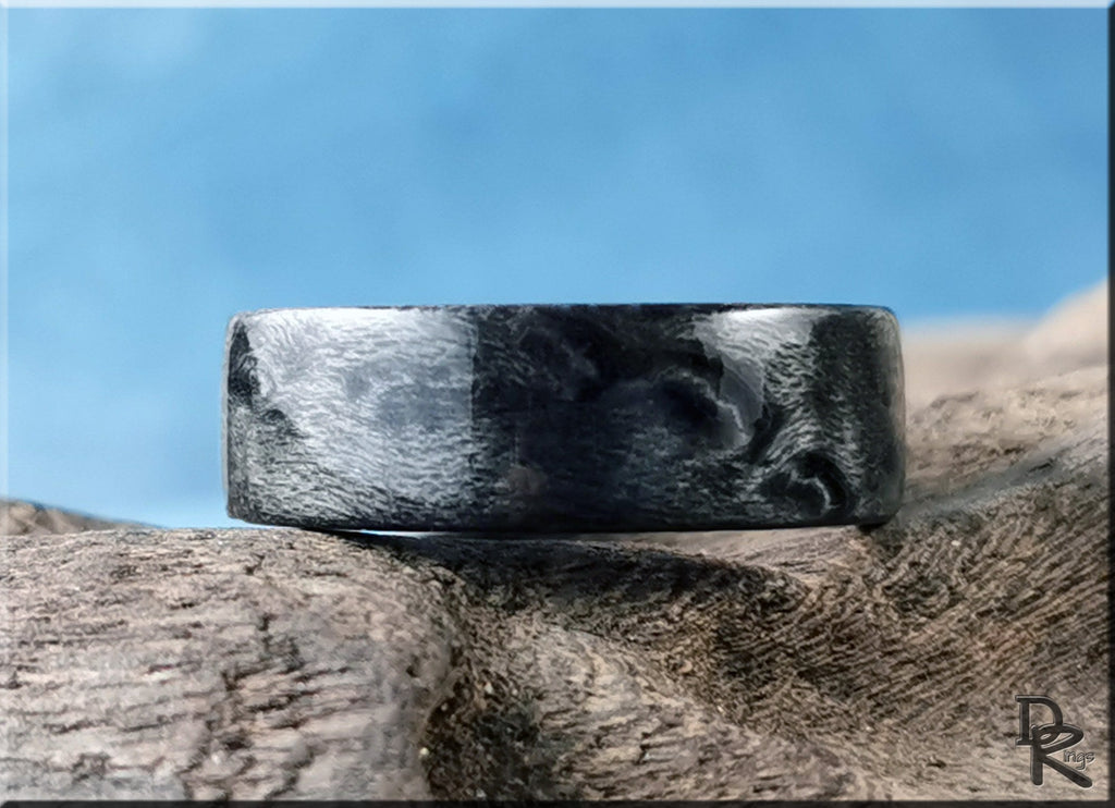 Grey maple ring by DR Rings with smooth textured wood grain design on natural wood background