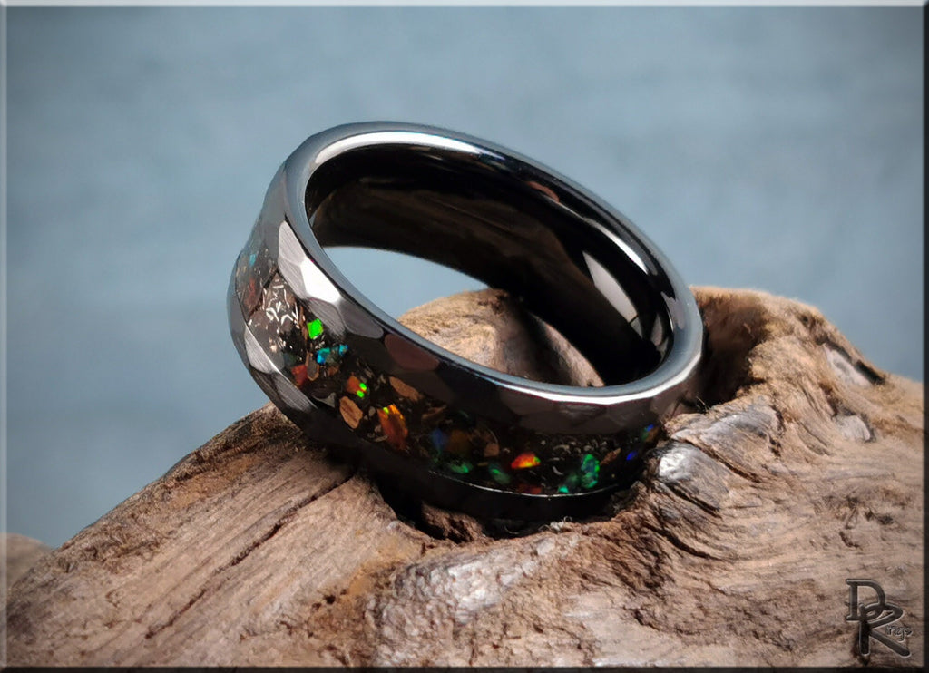 Hammered ceramic ring with inlay featuring iridescent colorful stones on dark band by DR Rings