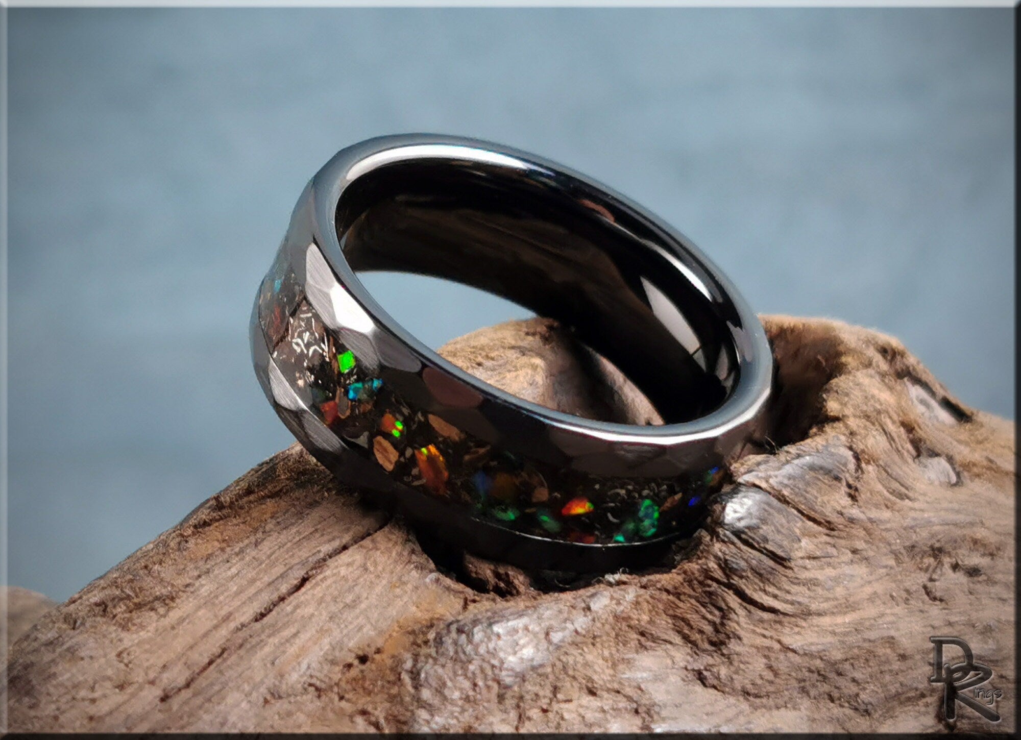 Hammered ceramic ring with inlay featuring iridescent colorful stones on dark band by DR Rings