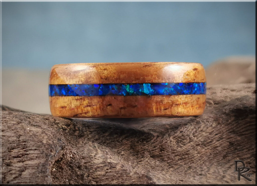 DR Rings koa wood ring with opal and ceramic featuring a vibrant blue opal inlay on natural koa wood