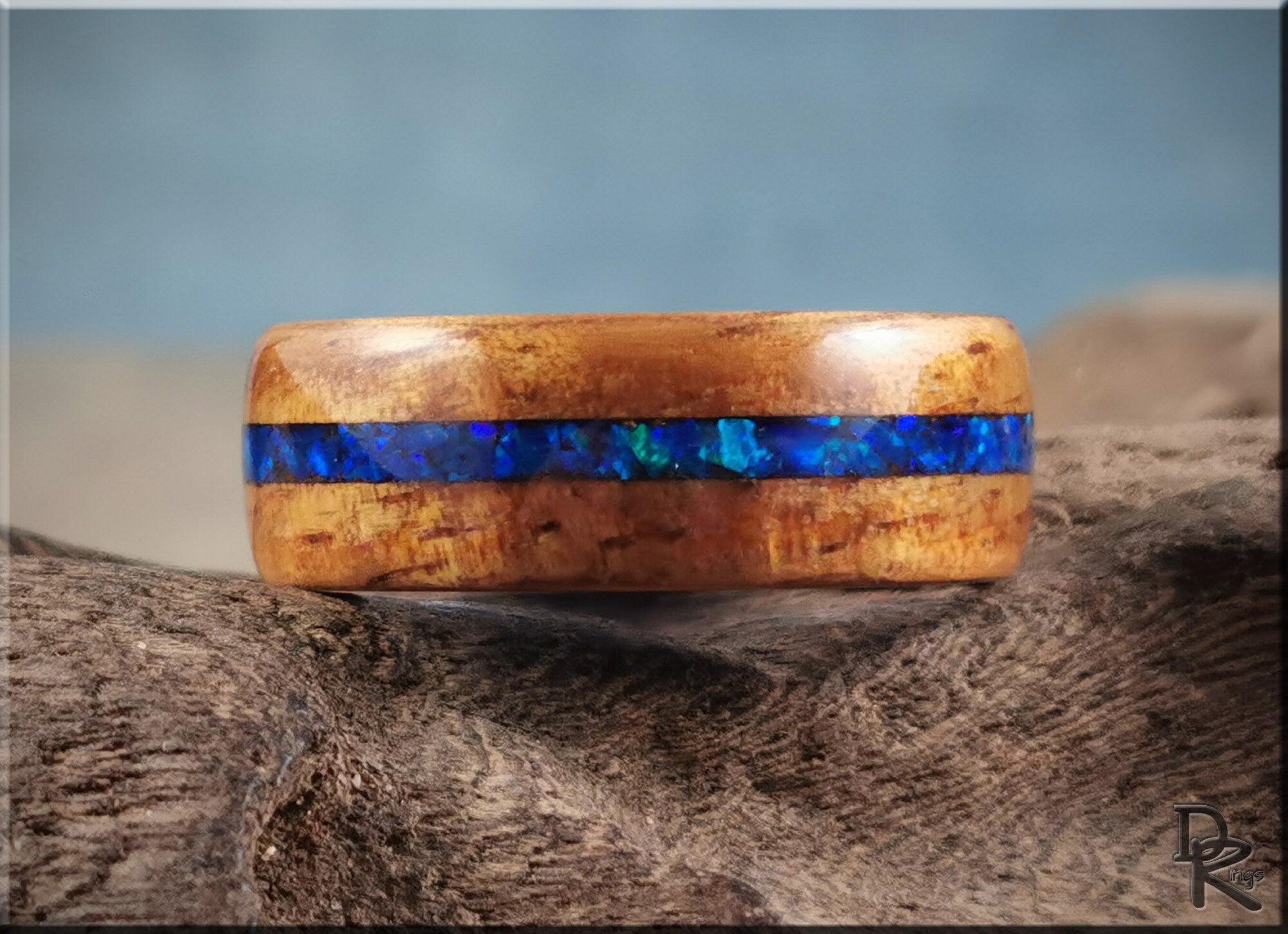 DR Rings koa wood ring with opal and ceramic featuring a vibrant blue opal inlay on natural koa wood