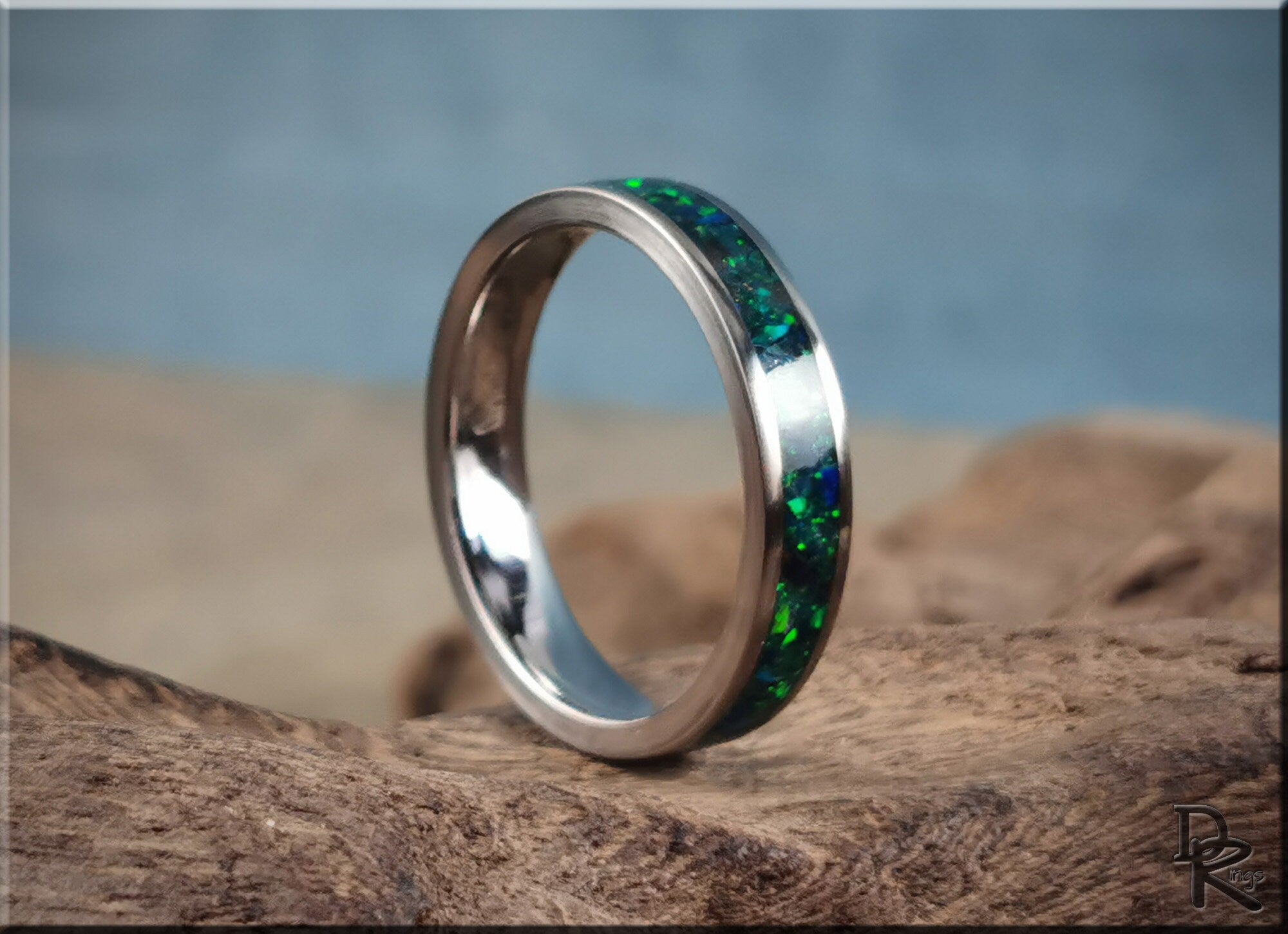 Narrow titanium ring with opal inlay featuring green and blue tones by DR Rings