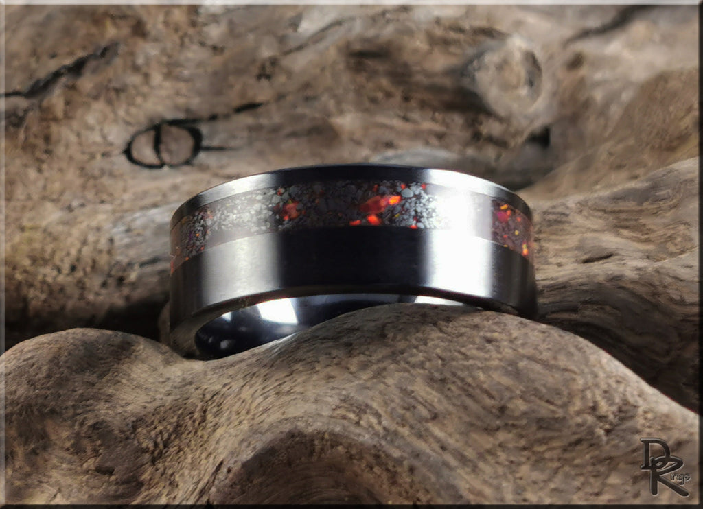 DR Rings ring opal with fiery red opal inlay set in a polished silver band on textured wood