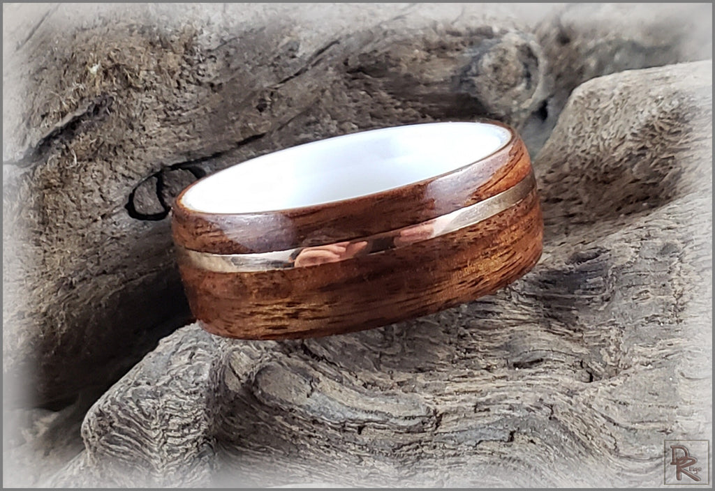 Rosewood ring with wire inlay by DR Rings displayed on natural wood background