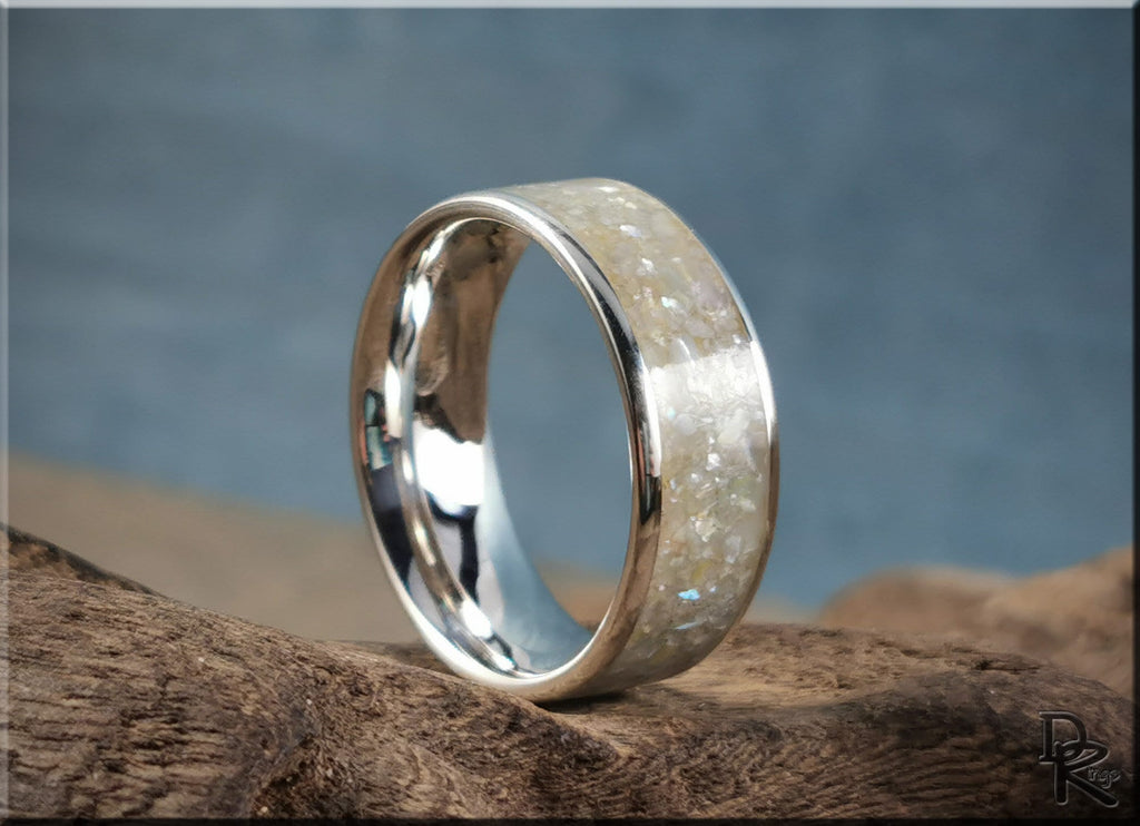 DR Rings sterling silver ring with pearl inlay featuring a polished band and textured pearl design