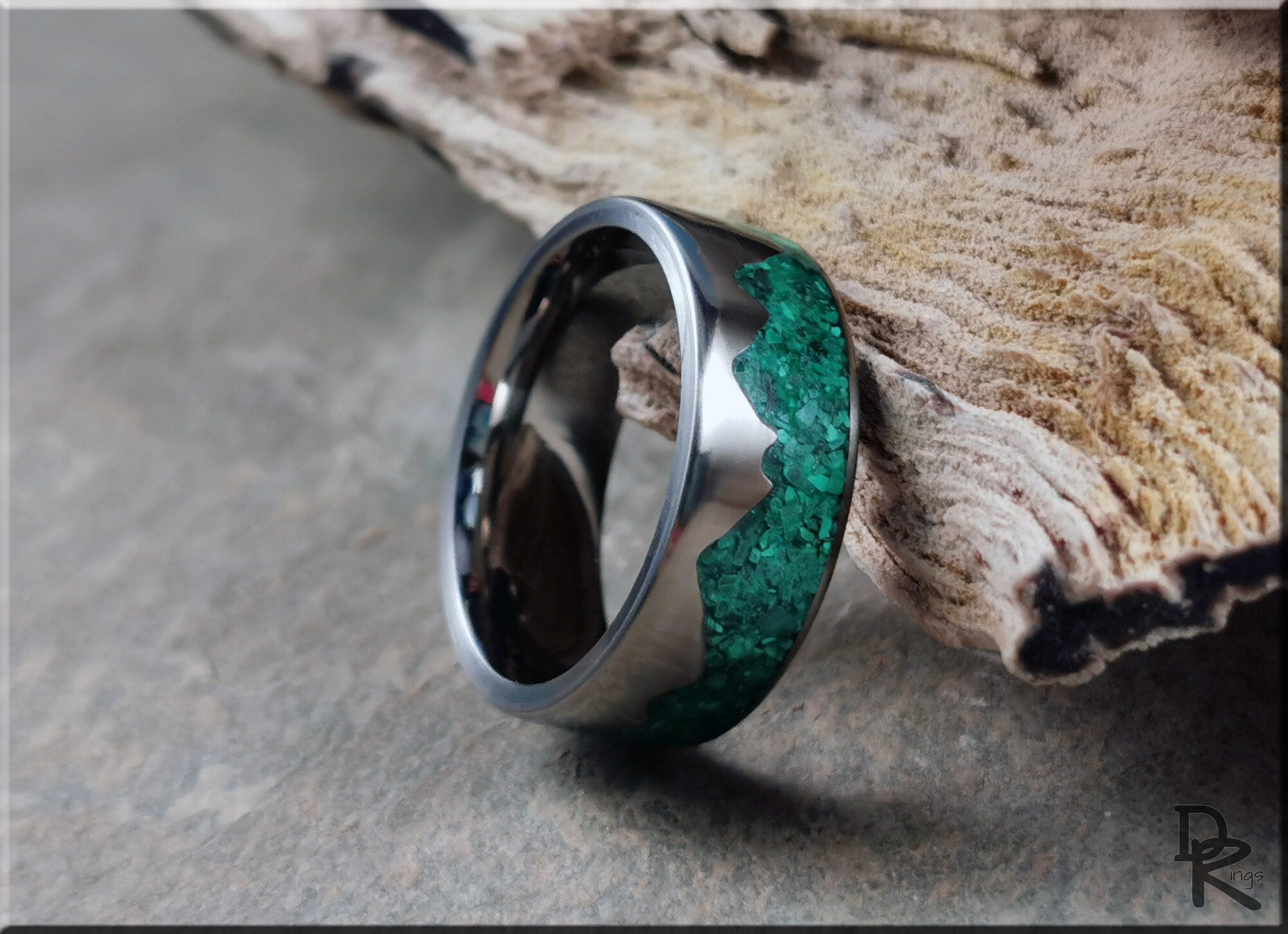 Titanium mountain ring with malachite inlay featuring vibrant green stone detail on sleek band