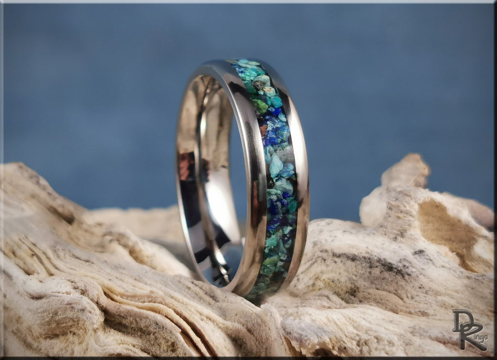 DR Rings titanium ring with azurite inlay featuring blue and green stone details on natural wood
