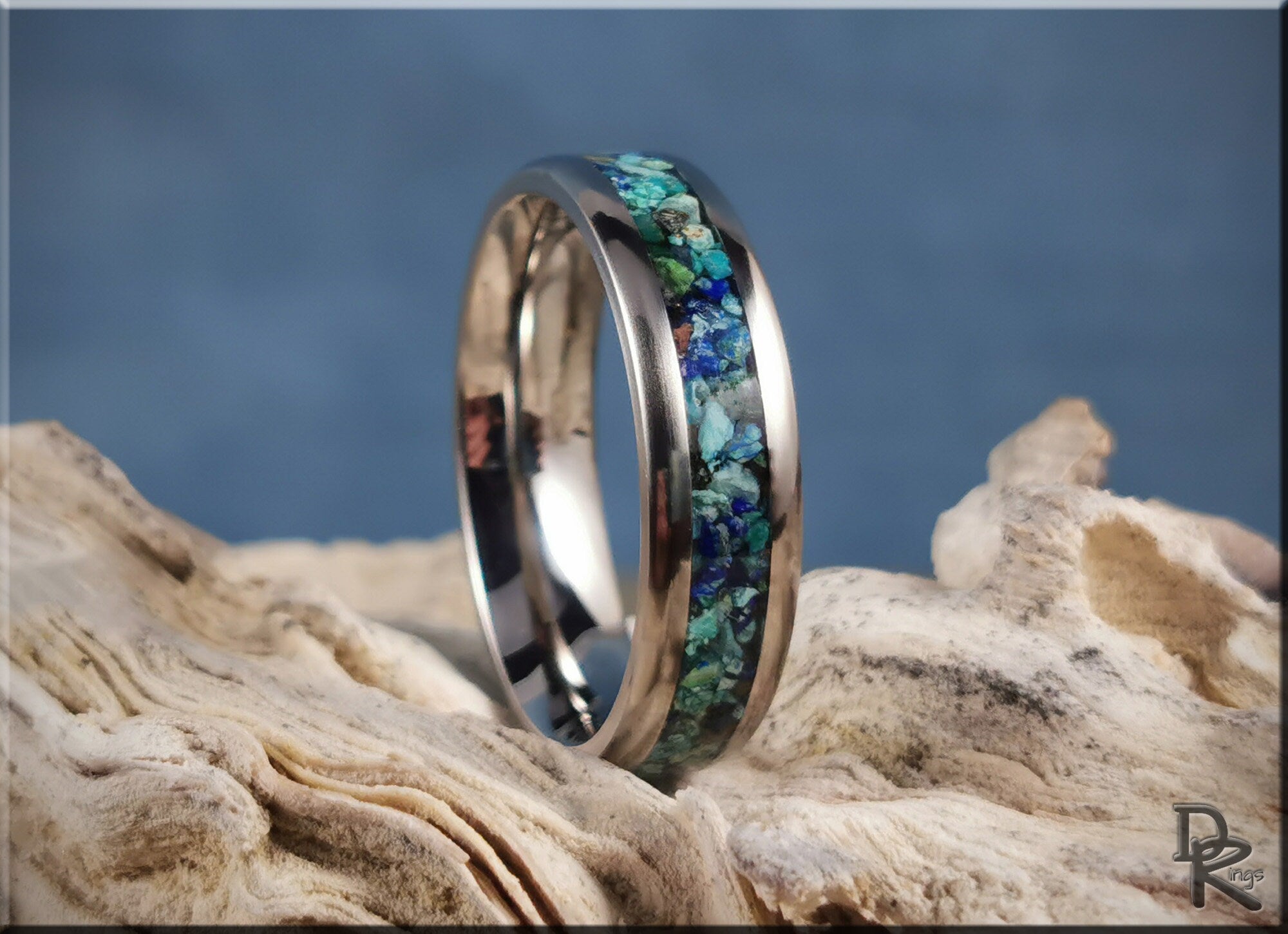 DR Rings titanium ring with azurite inlay featuring blue and green stone details on natural wood