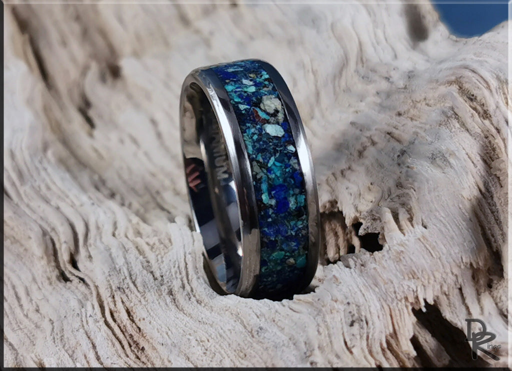 DR Rings titanium ring with azurite inlay displayed on textured wood background