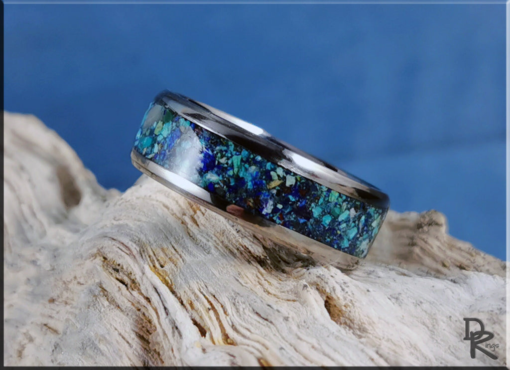 DR Rings titanium ring with azurite blue and green stone inlay on textured natural background