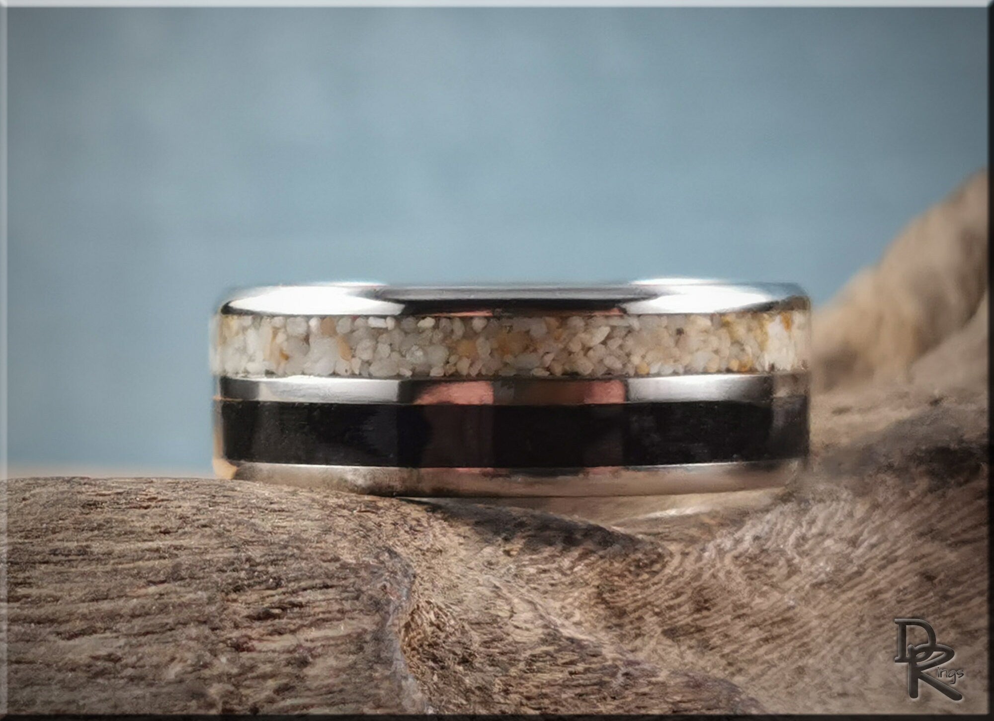 DR Rings titanium ring with dual sand inlays featuring light and dark sand layers on a silver band