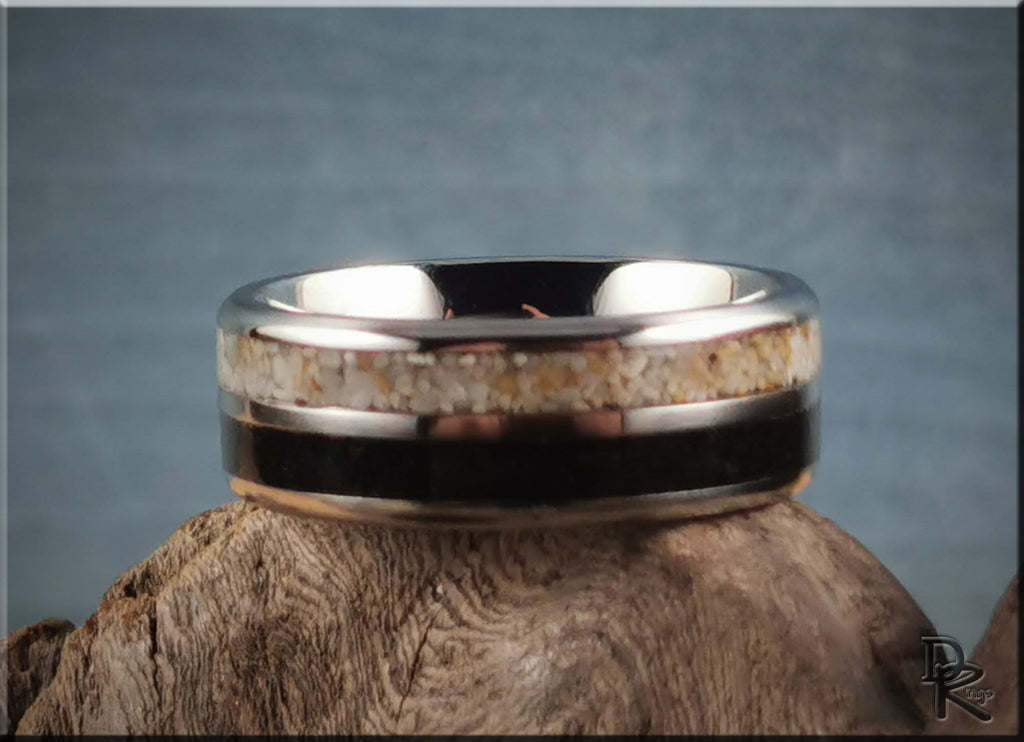 Titanium ring with dual sand inlays by DR Rings displayed on rustic wood