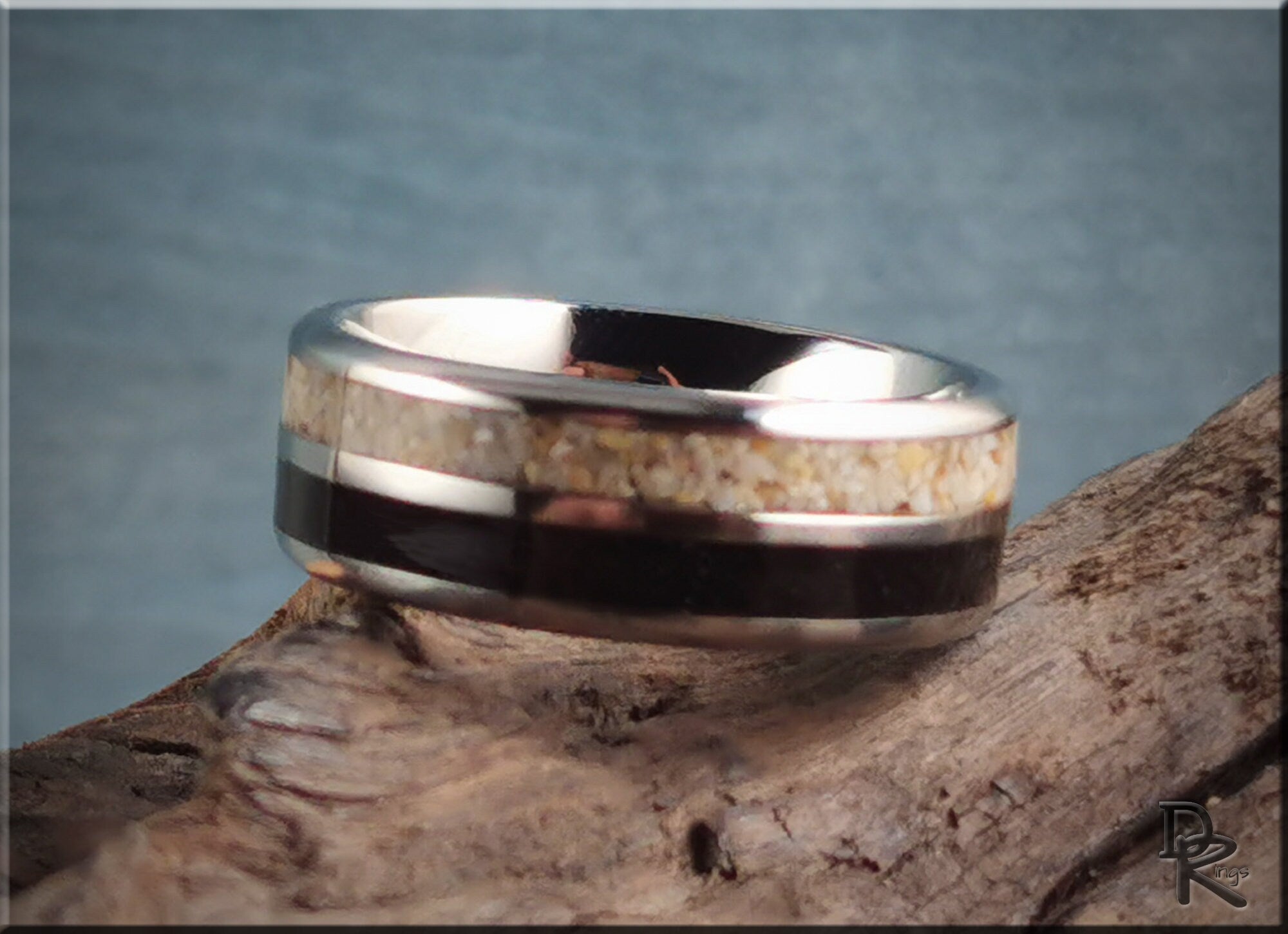 Titanium ring with dual sand inlays featuring a polished silver finish and natural sand detail