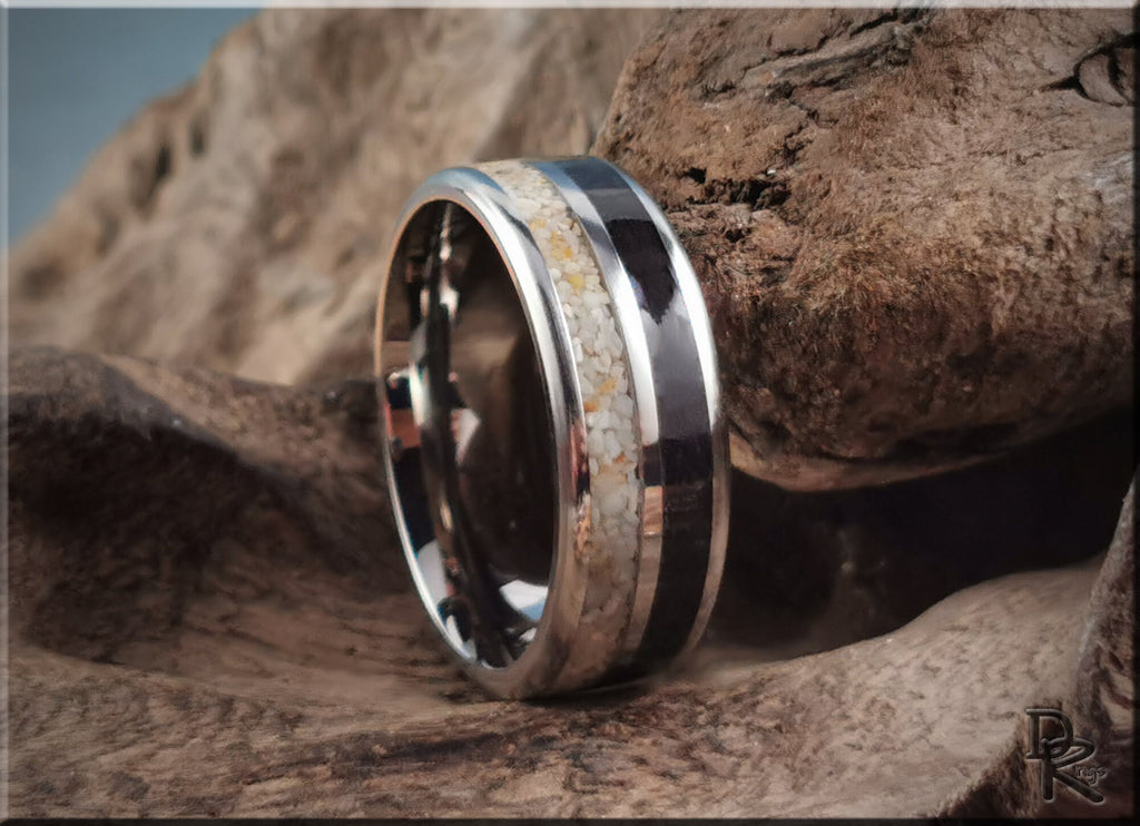 Titanium ring with dual sand inlays by DR Rings displayed on natural wood background