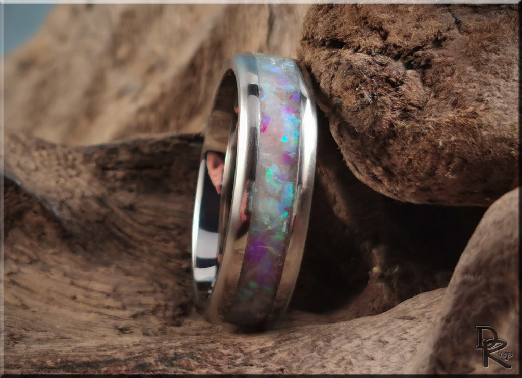 DR Rings titanium ring with inlay featuring a colorful opal design set in a polished silver band