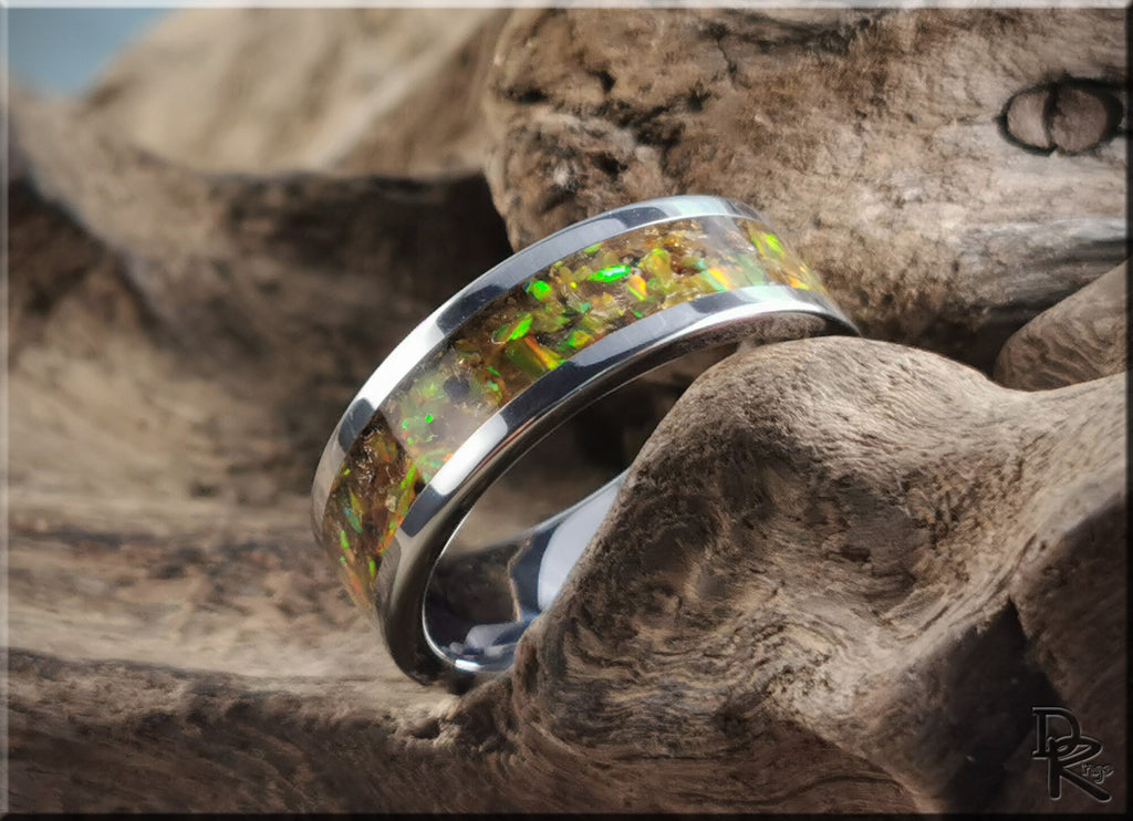 DR Rings titanium ring with inlay featuring a polished silver band and vibrant green and gold opal design