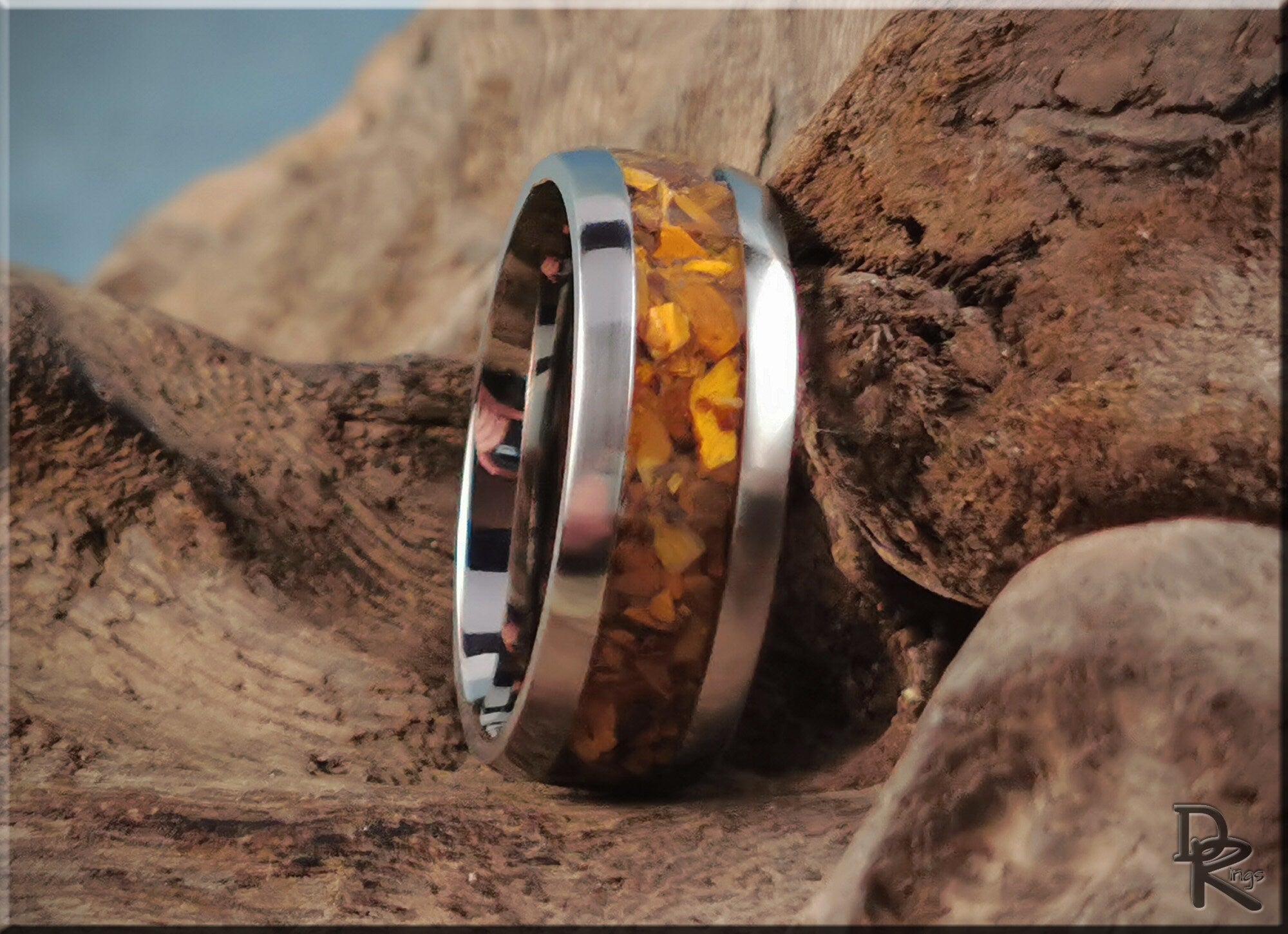 DR Rings titanium ring with inlay featuring amber stone set in polished silver band
