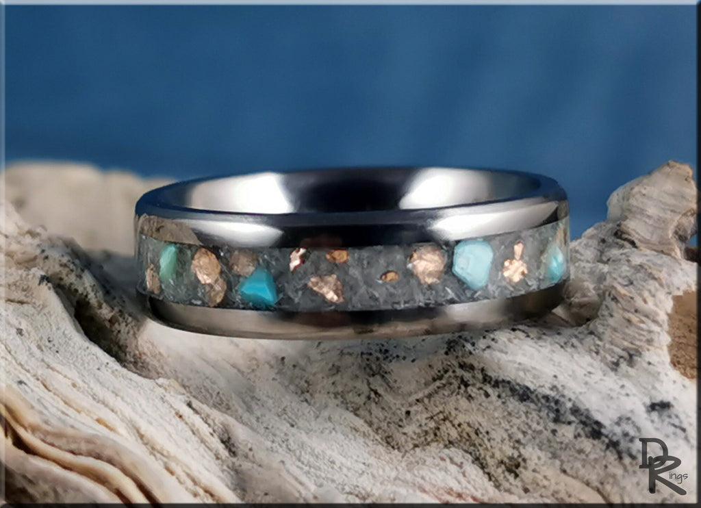 DR Rings titanium ring with inlay featuring turquoise and copper accents on rustic background