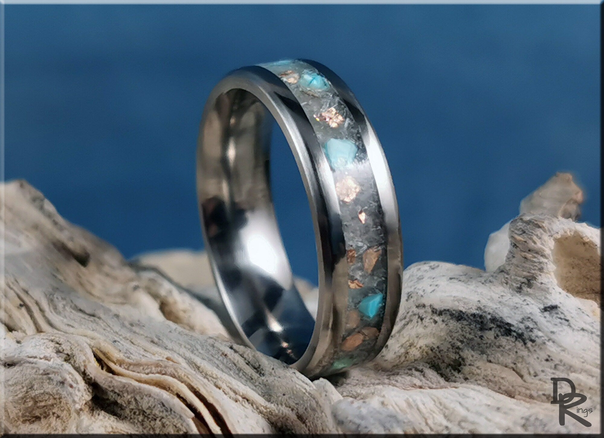DR Rings titanium ring with inlay featuring turquoise and copper flakes on natural driftwood