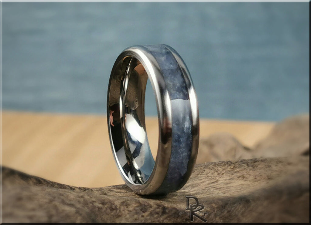 DR Rings titanium ring with kyanite blue stone inlay on a natural wood surface