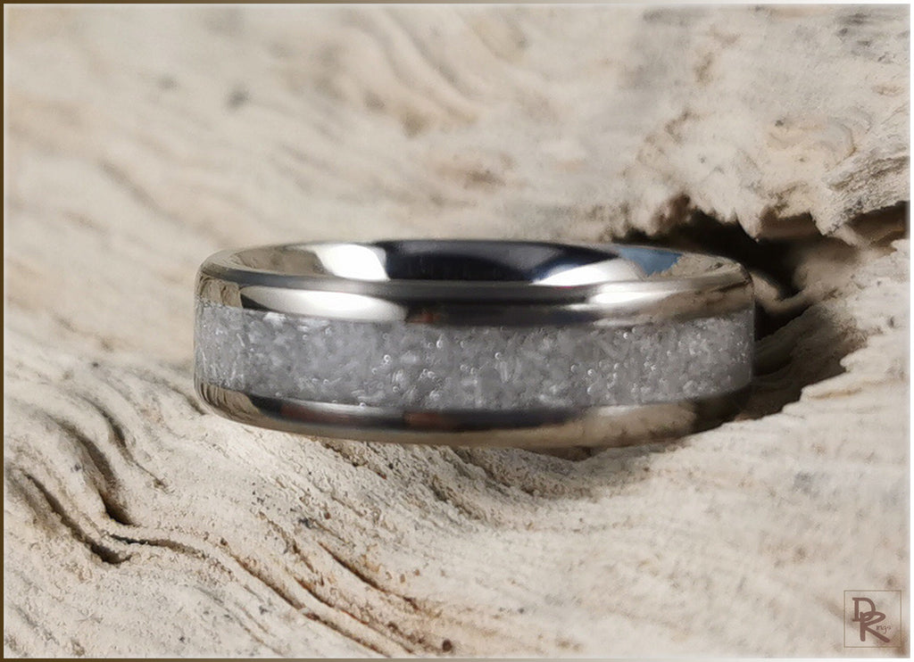 DR Rings titanium ring with selenite inlay on textured wooden surface