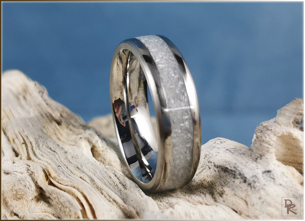 DR Rings titanium ring with selenite inlay on natural textured stone background