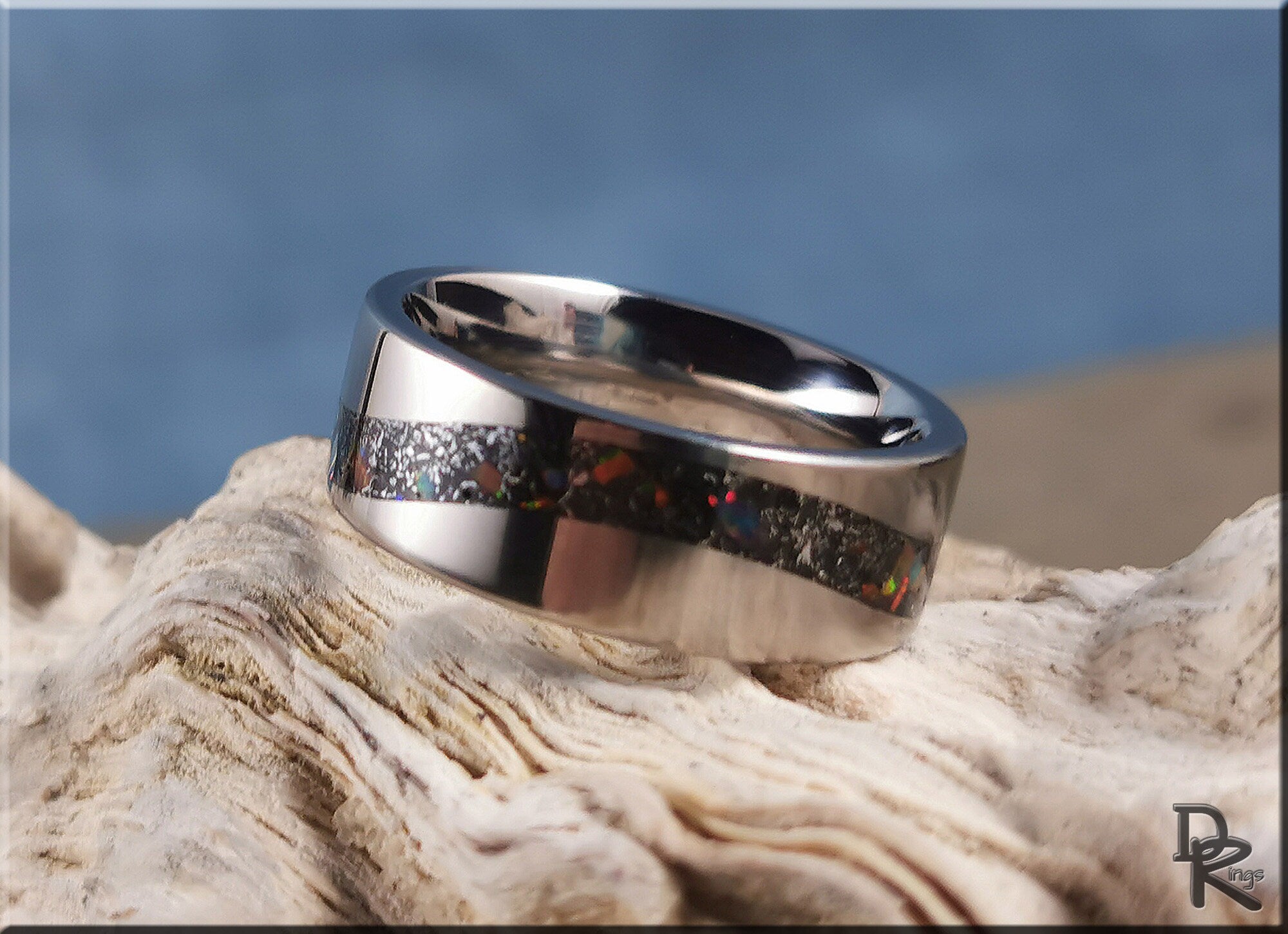 DR Rings titanium smart ring with black inlay and polished silver finish on textured surface