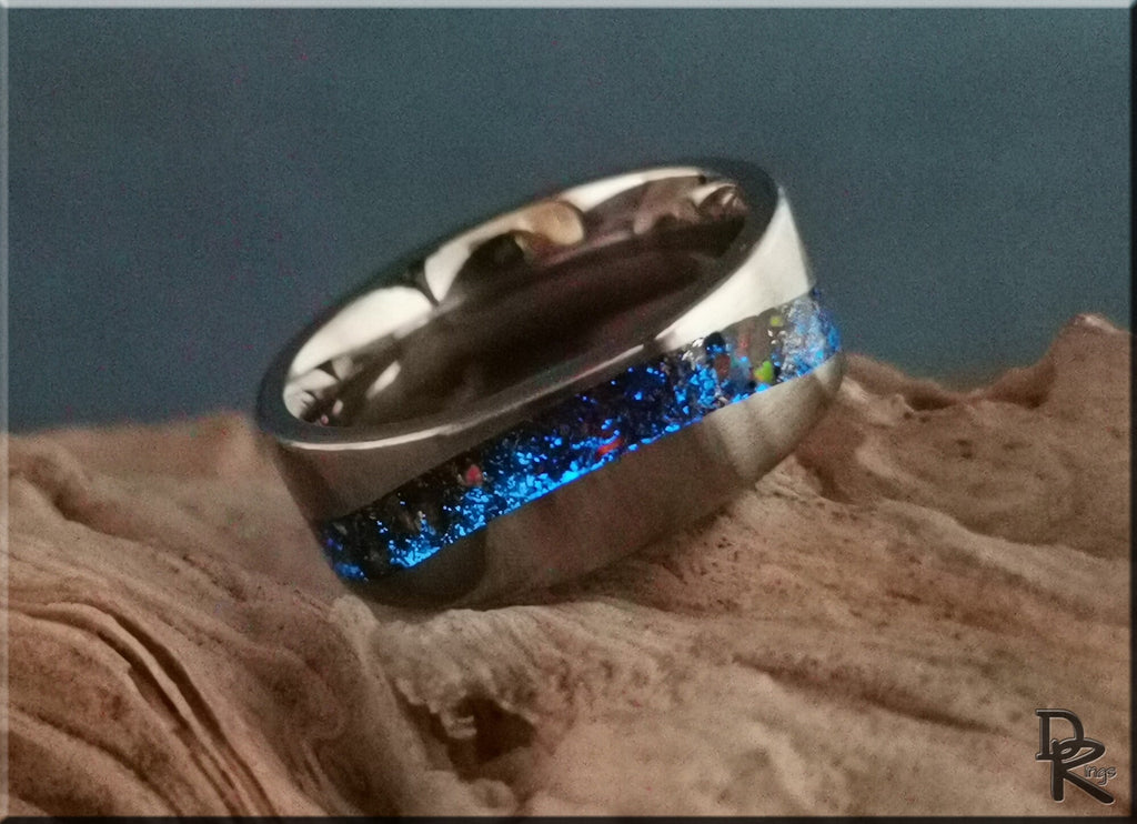 DR Rings titanium smart ring with blue shimmering inlay on textured surface