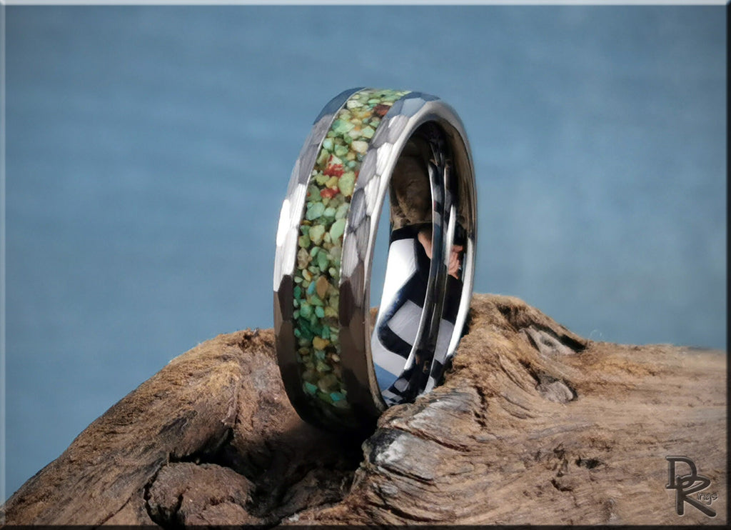 DR Rings tungsten as a ring with green and brown stone inlay and polished beveled edges on wood