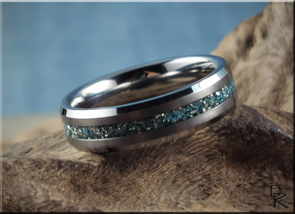 DR Rings tungsten as a ring with blue stone inlay and polished silver finish on textured surface
