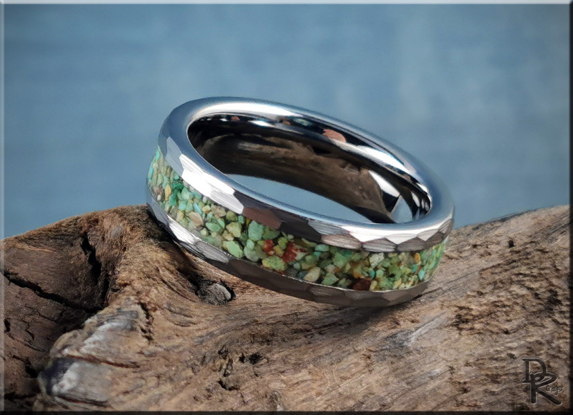 DR Rings tungsten as a ring with green stone inlay on polished silver band on rustic wood
