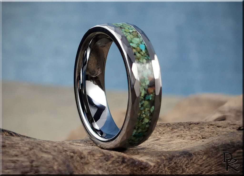 DR Rings tungsten as a ring with green stone inlay and polished silver finish on textured background