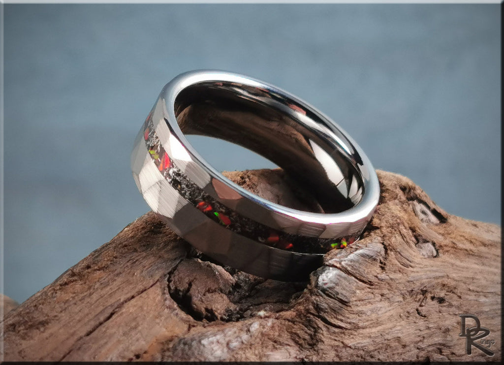 DR Rings polished and faceted tungsten as a ring displayed on natural wood background