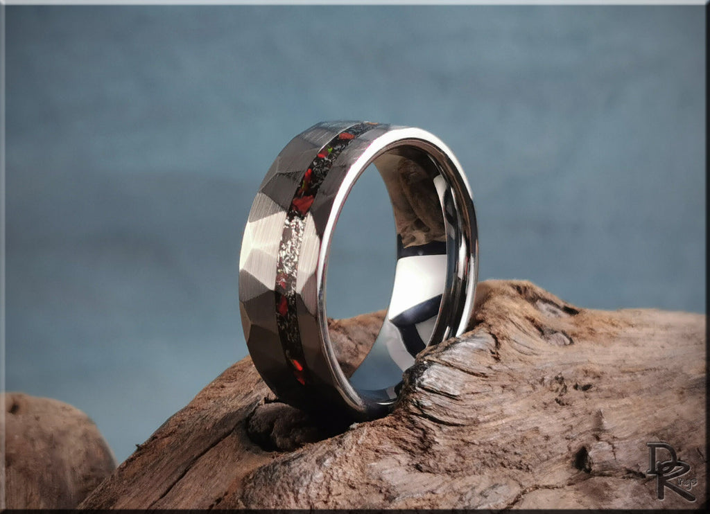 DR Rings tungsten as a ring with faceted design and red carbon fiber inlay on rustic wood