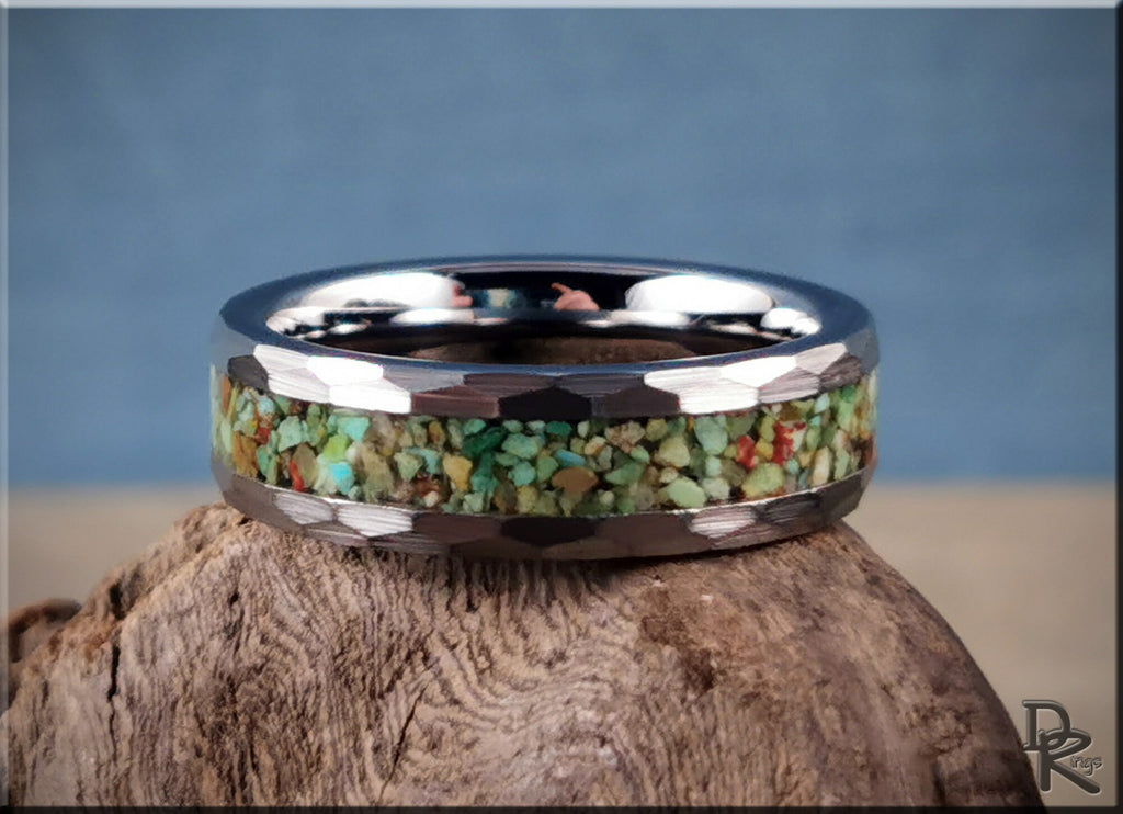 DR Rings tungsten as a ring with colorful stone inlay and polished beveled edges on rough wood