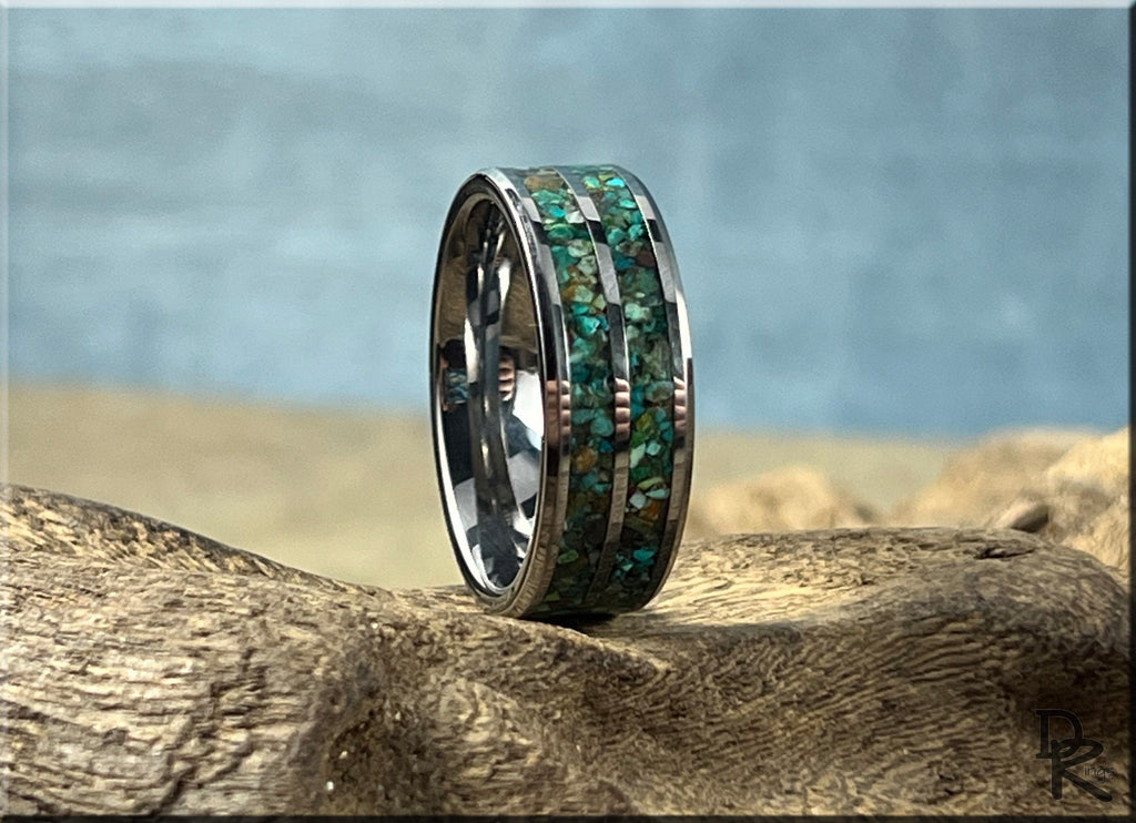 Tungsten carbide ring with two inlays featuring green and blue mosaic design on driftwood