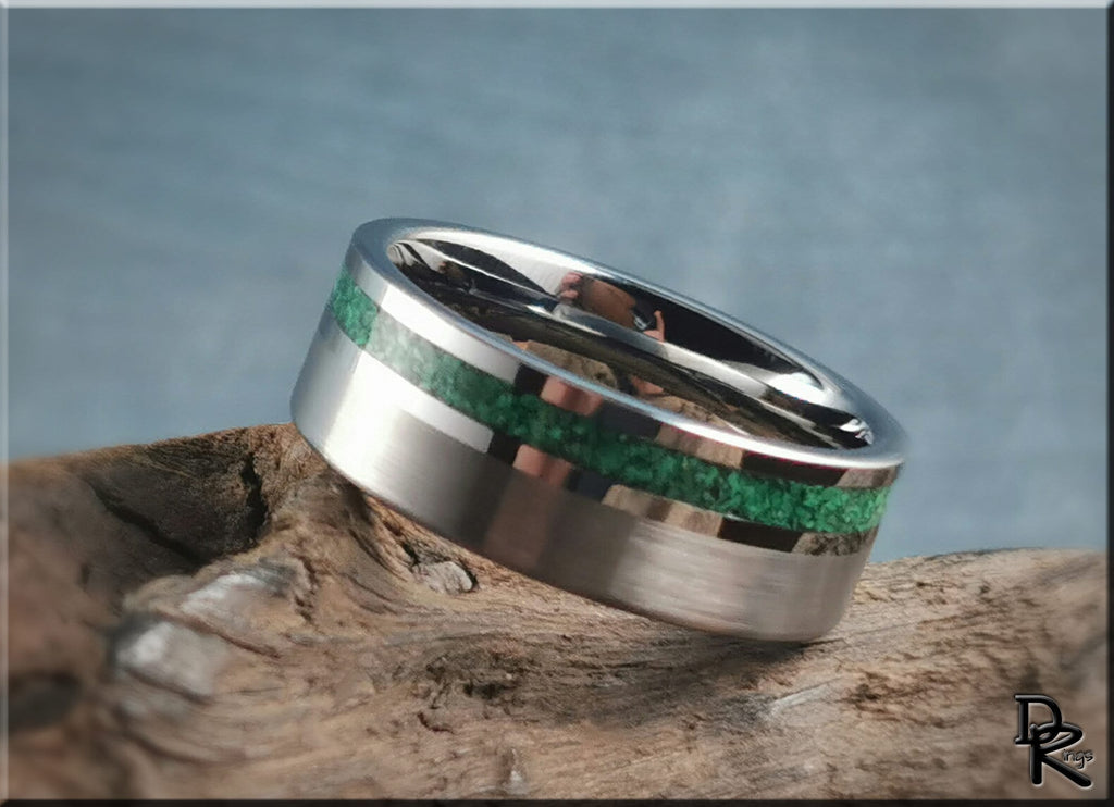 DR Rings tungsten ring carbide with green inlay and polished silver finish on rustic wood