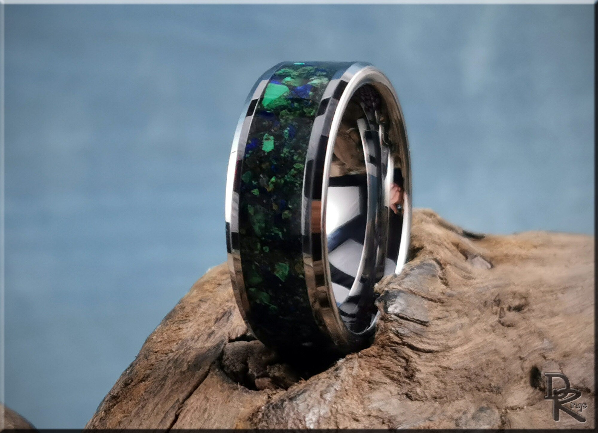 DR Rings tungsten ring carbide with green and black stone inlay on rustic wooden surface