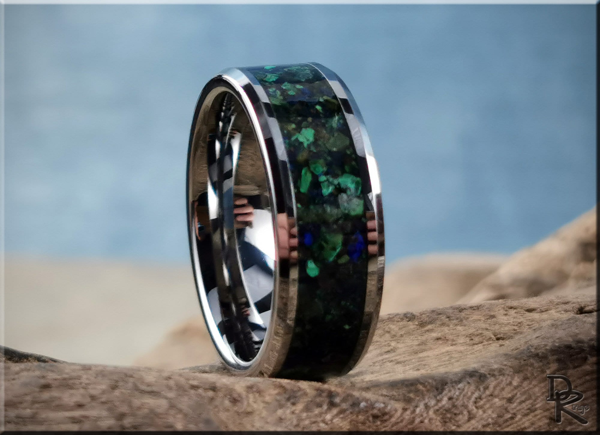 DR Rings tungsten ring carbide with black and green stone inlay on rustic surface
