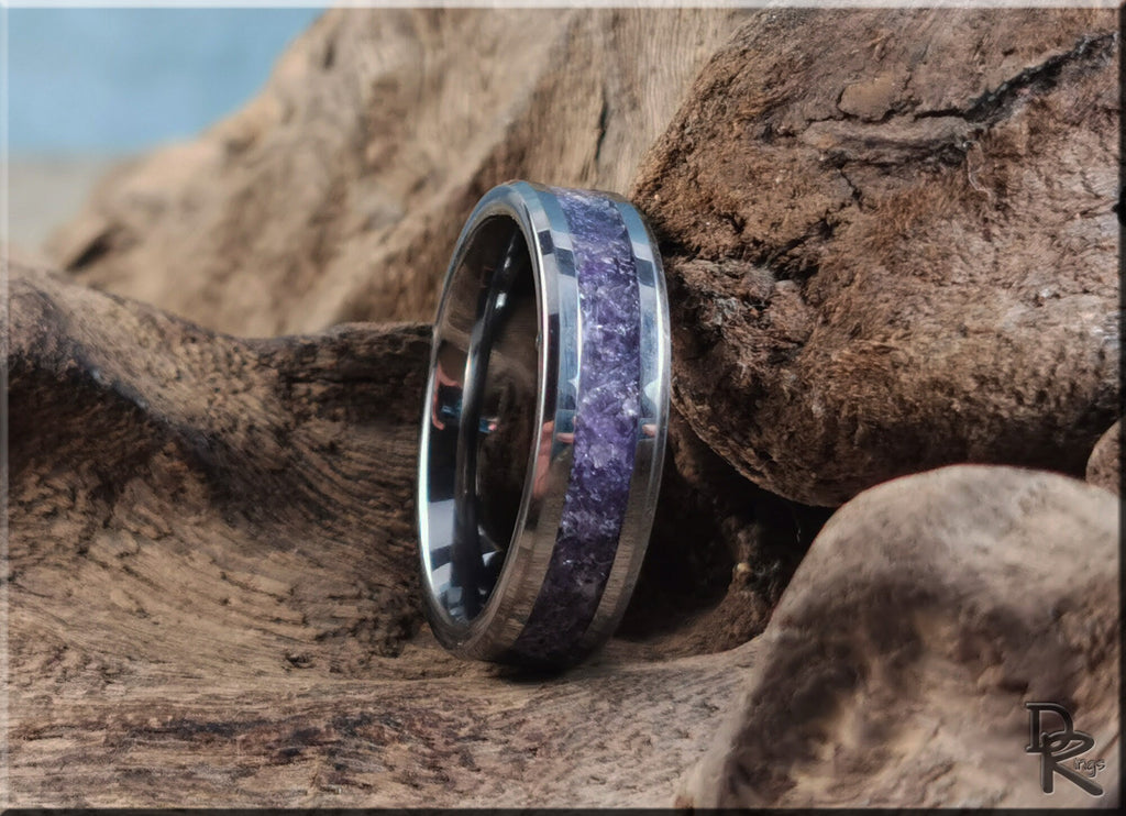DR Rings tungsten ring with amethyst purple stone inlay on rustic wooden background